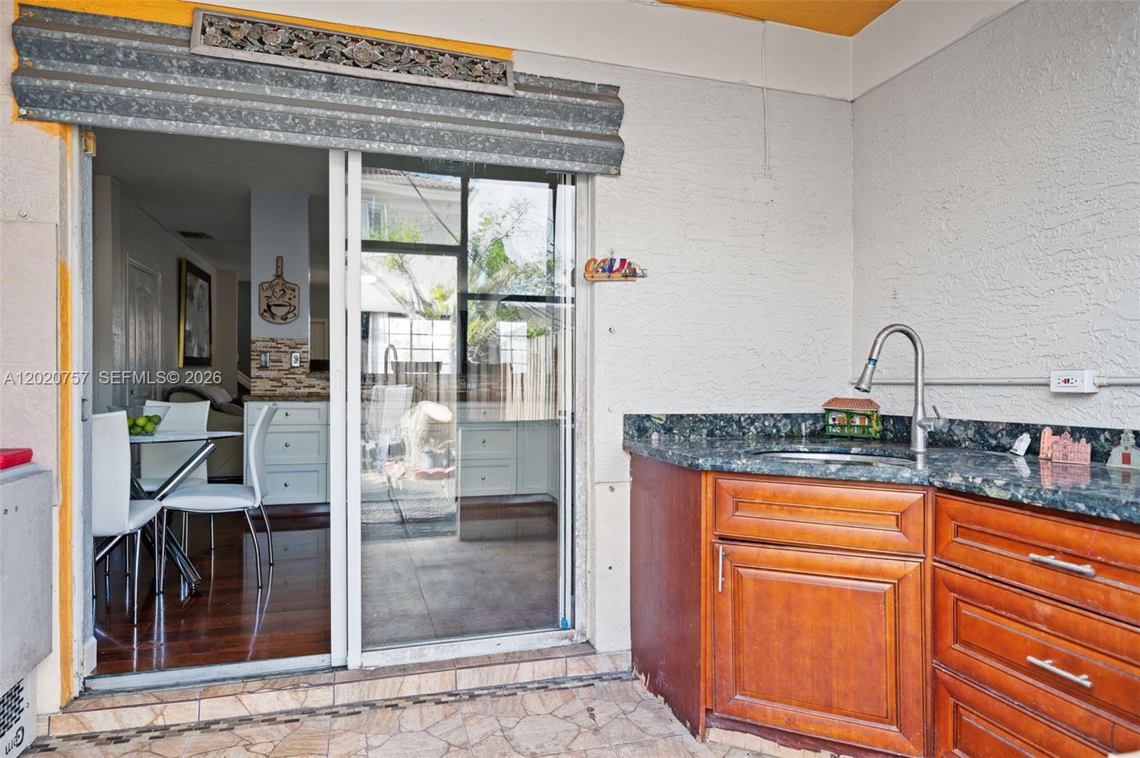 255 East 3rd Street, Unit 1 Hialeah, FL 33010 - Photo 25 of 38 a kitchen with granite countertop a refrigerator and a sink