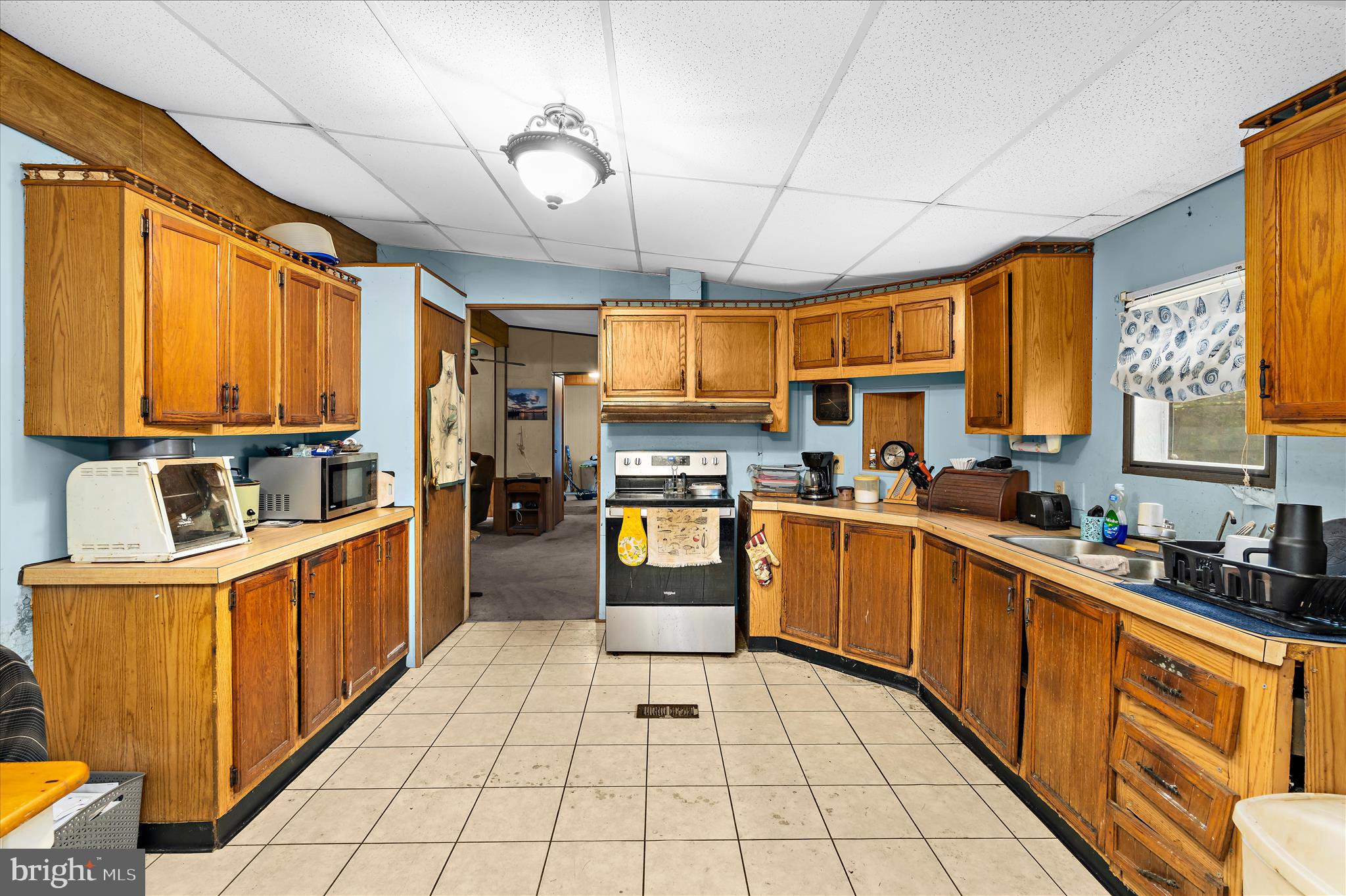 151 Darlington Road Havre de Grace, MD 21078 - Photo 28 of 46 a kitchen with stainless steel appliances granite countertop a sink a stove cabinets counter space and a window
