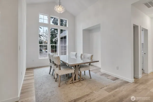 a dining room with furniture and window