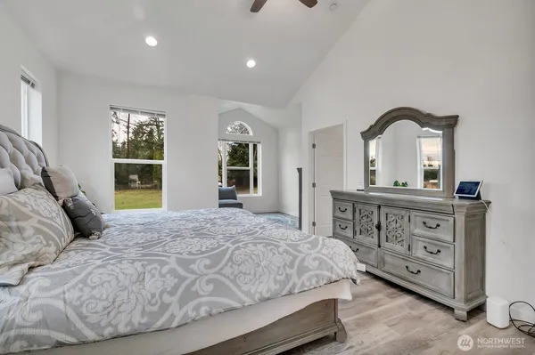 a bedroom with a bed and a dresser