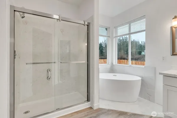 a bathroom with a bathtub and a shower