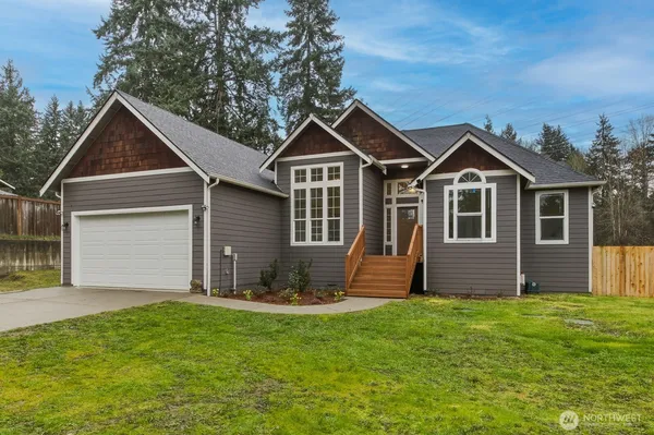 a front view of a house with a yard