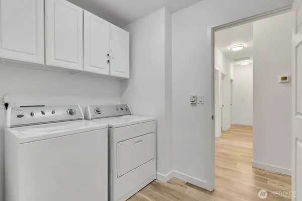 a view of storage and utility room with washer and dryer