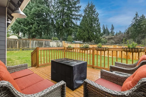 a view of a roof deck with wooden floor and fence