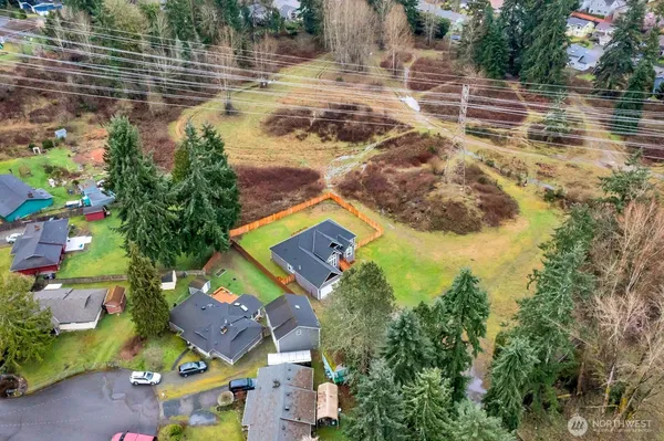 a aerial view of residential house with outdoor space and swimming pool