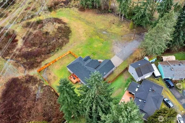 an aerial view of house with yard