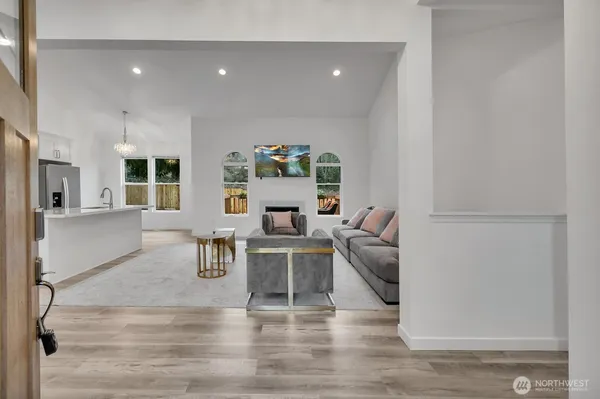 a living room with furniture and a table