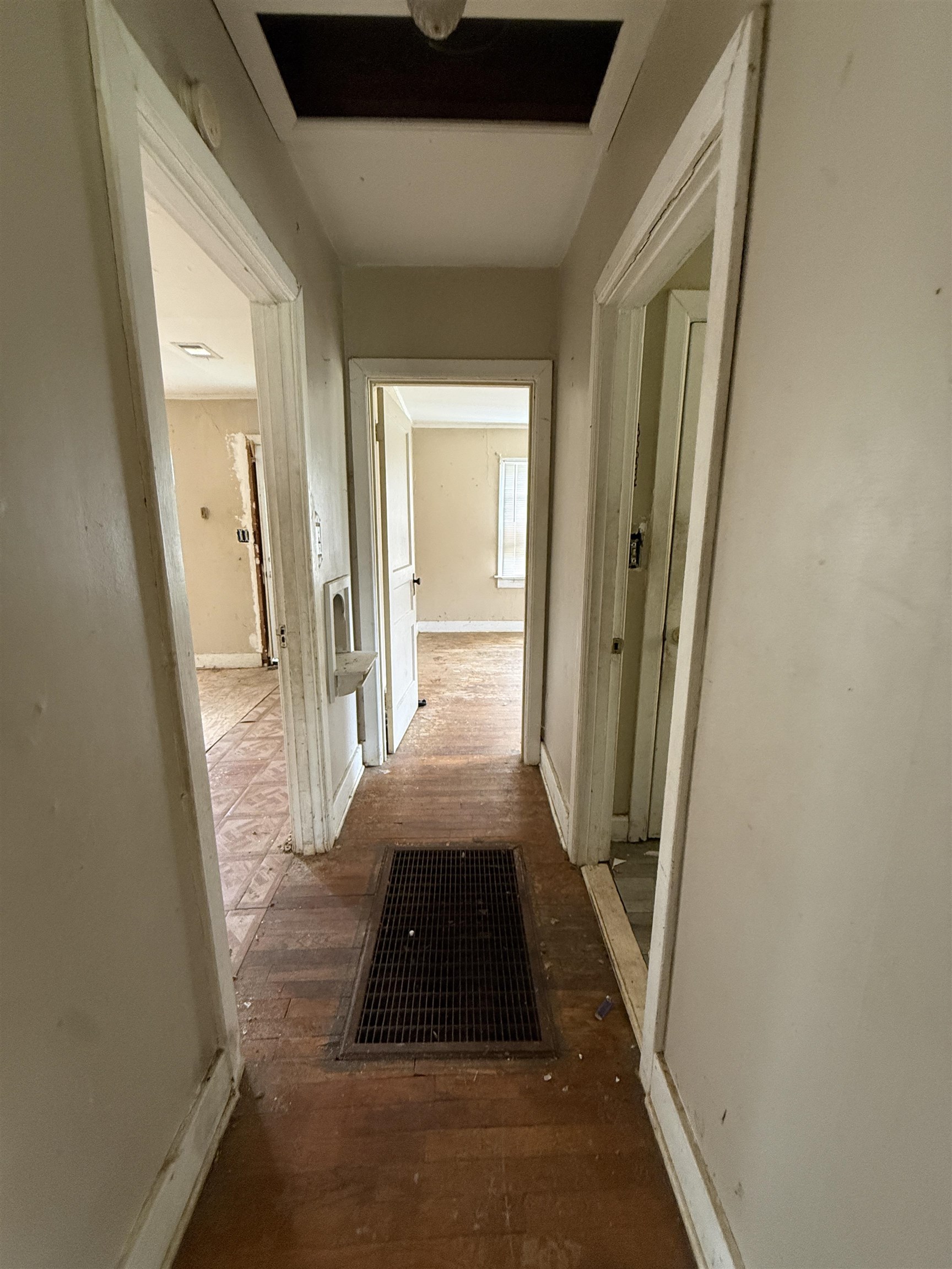 66 East Rollins Road Memphis, TN 38109 - Photo 11 of 31 Hallway with baseboards and hardwood / wood-style floors
