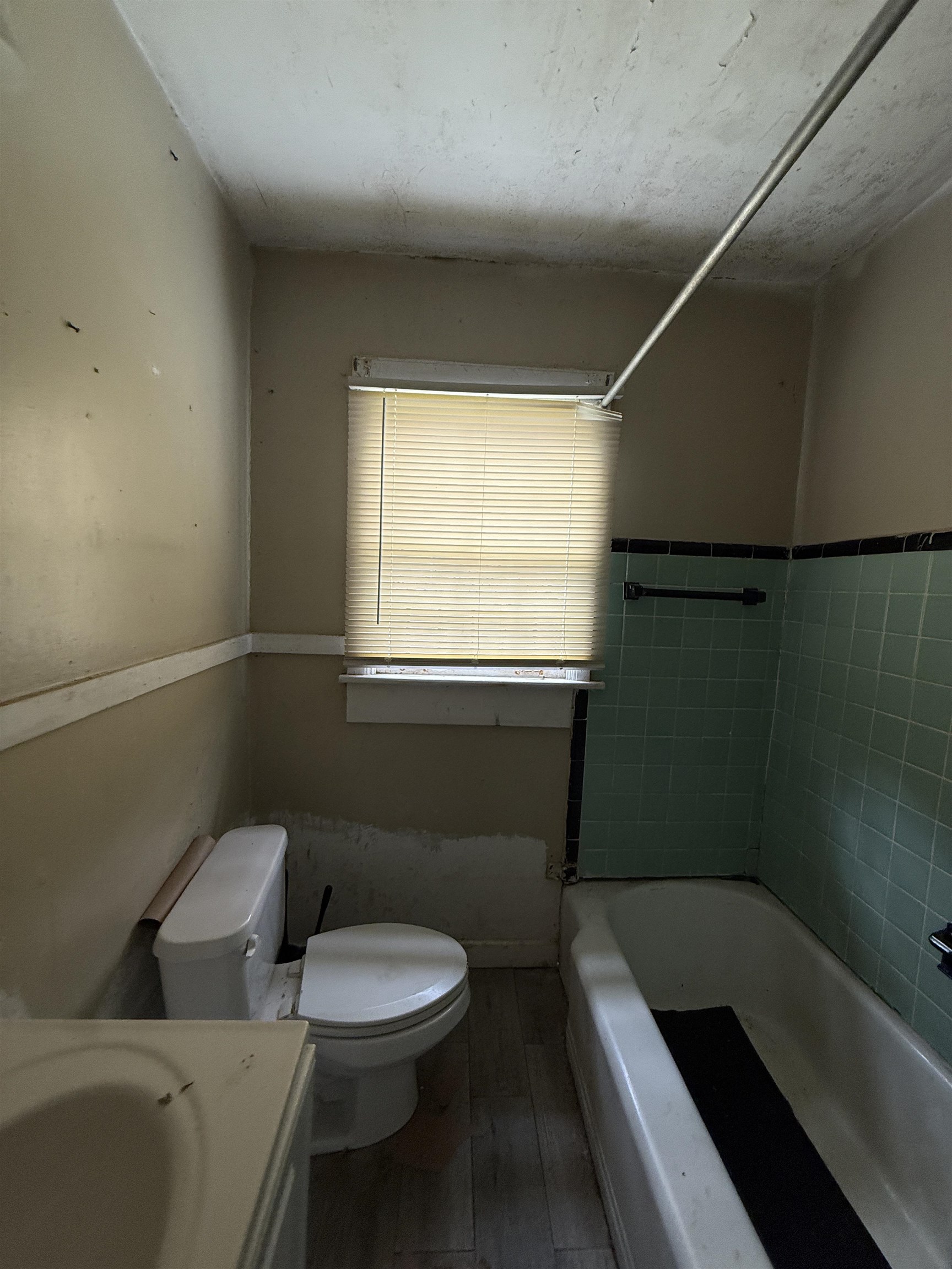 66 East Rollins Road Memphis, TN 38109 - Photo 16 of 31 Full bath with vanity, dark wood finished floors, and shower combination