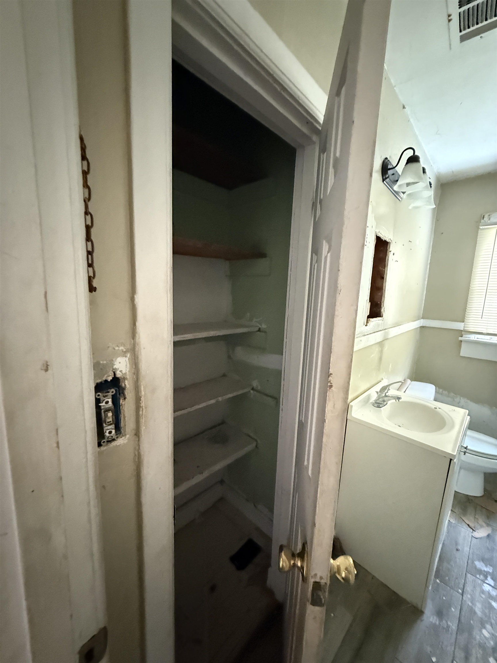 66 East Rollins Road Memphis, TN 38109 - Photo 17 of 31 Bathroom with vanity and dark wood-style floors