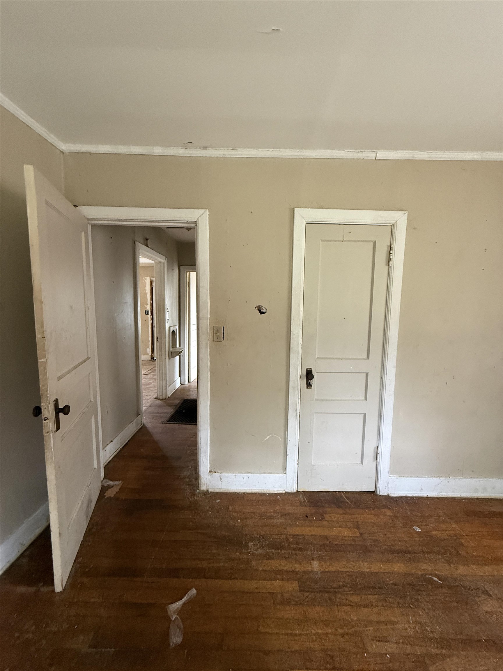 66 East Rollins Road Memphis, TN 38109 - Photo 23 of 31 Empty room with dark wood-type flooring and crown molding