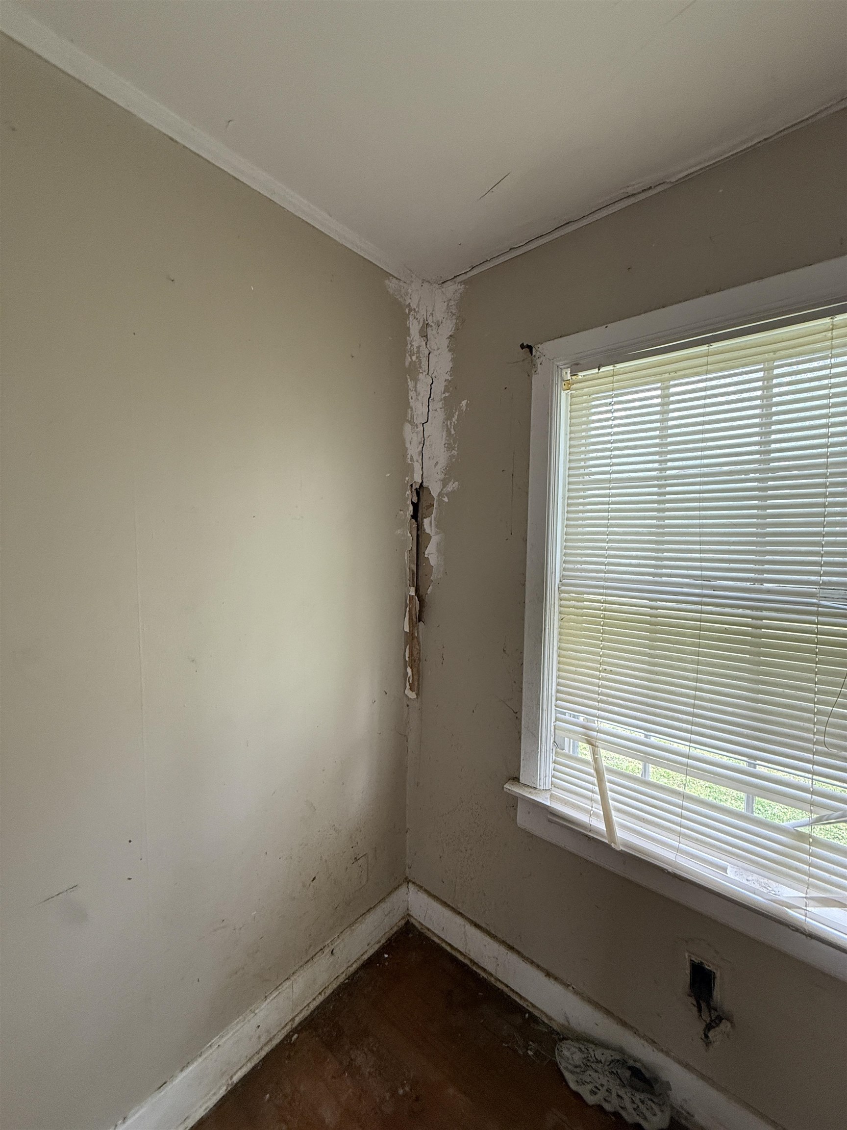 66 East Rollins Road Memphis, TN 38109 - Photo 25 of 31 Unfurnished room featuring baseboards and dark wood-style flooring