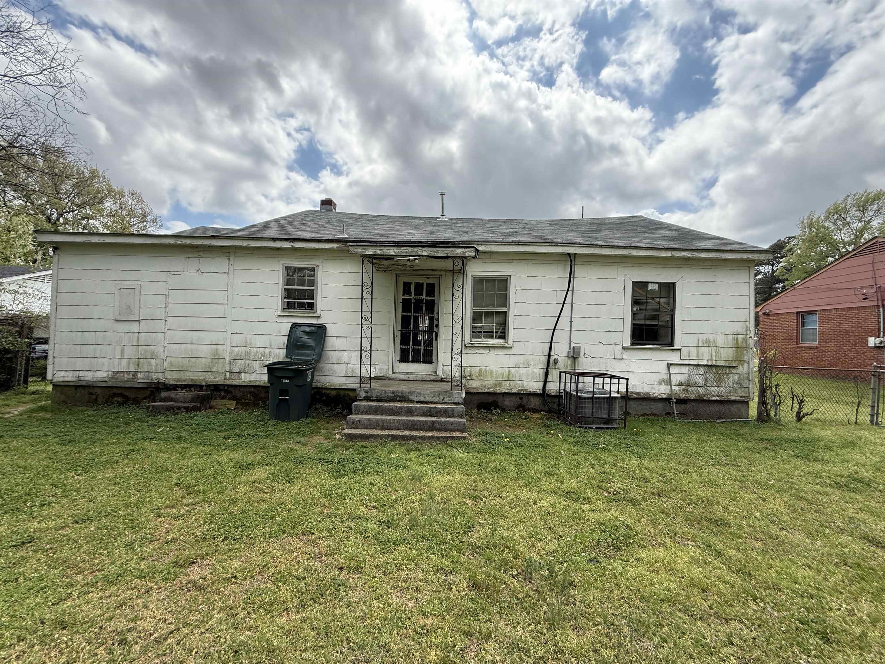 66 East Rollins Road Memphis, TN 38109 - Photo 31 of 31 Back of property with a shingled roof