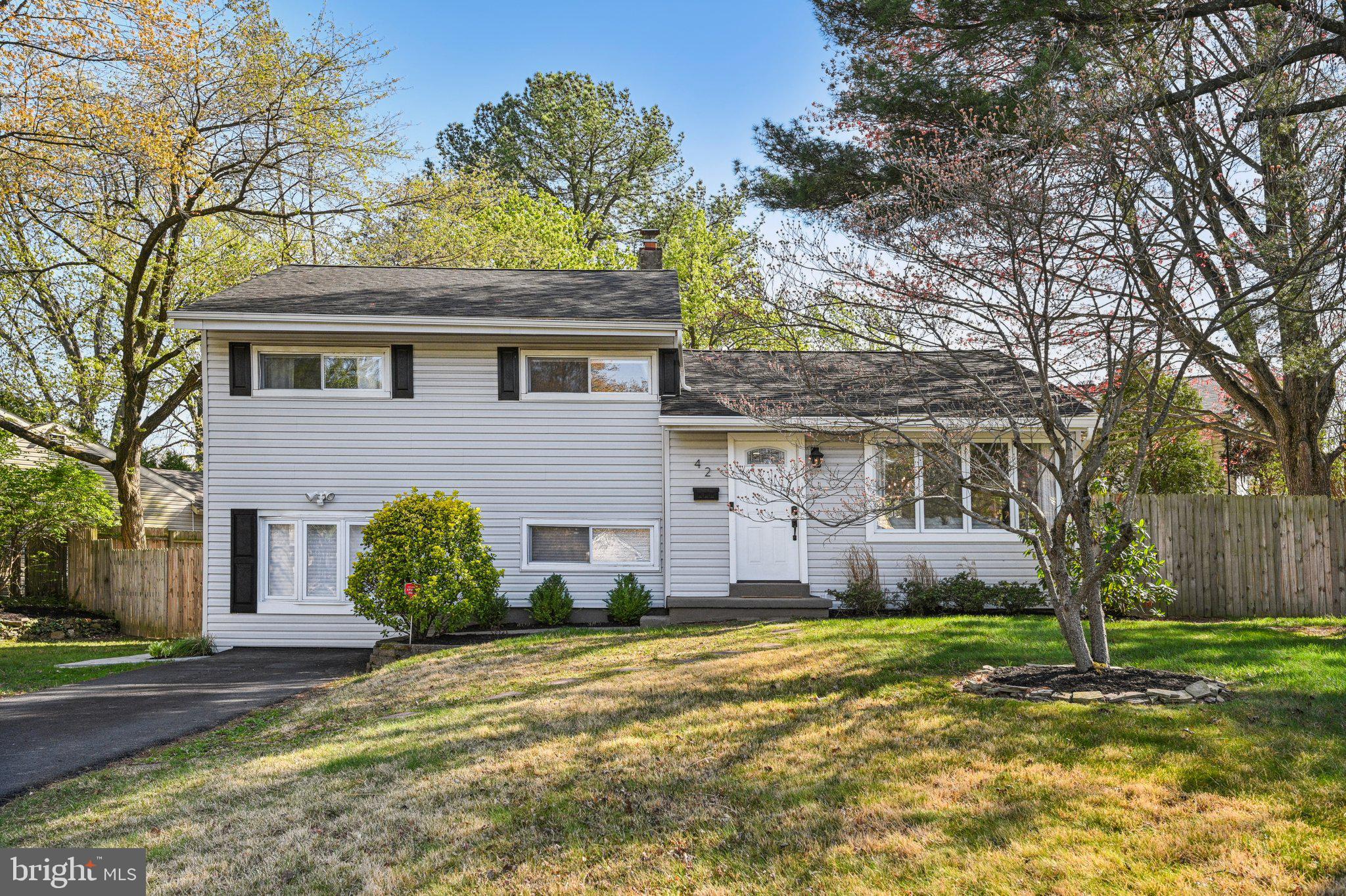 42 Cameo Road Claymont, DE 19703 - Photo 1 of 37 a front view of a house with a garden and tree