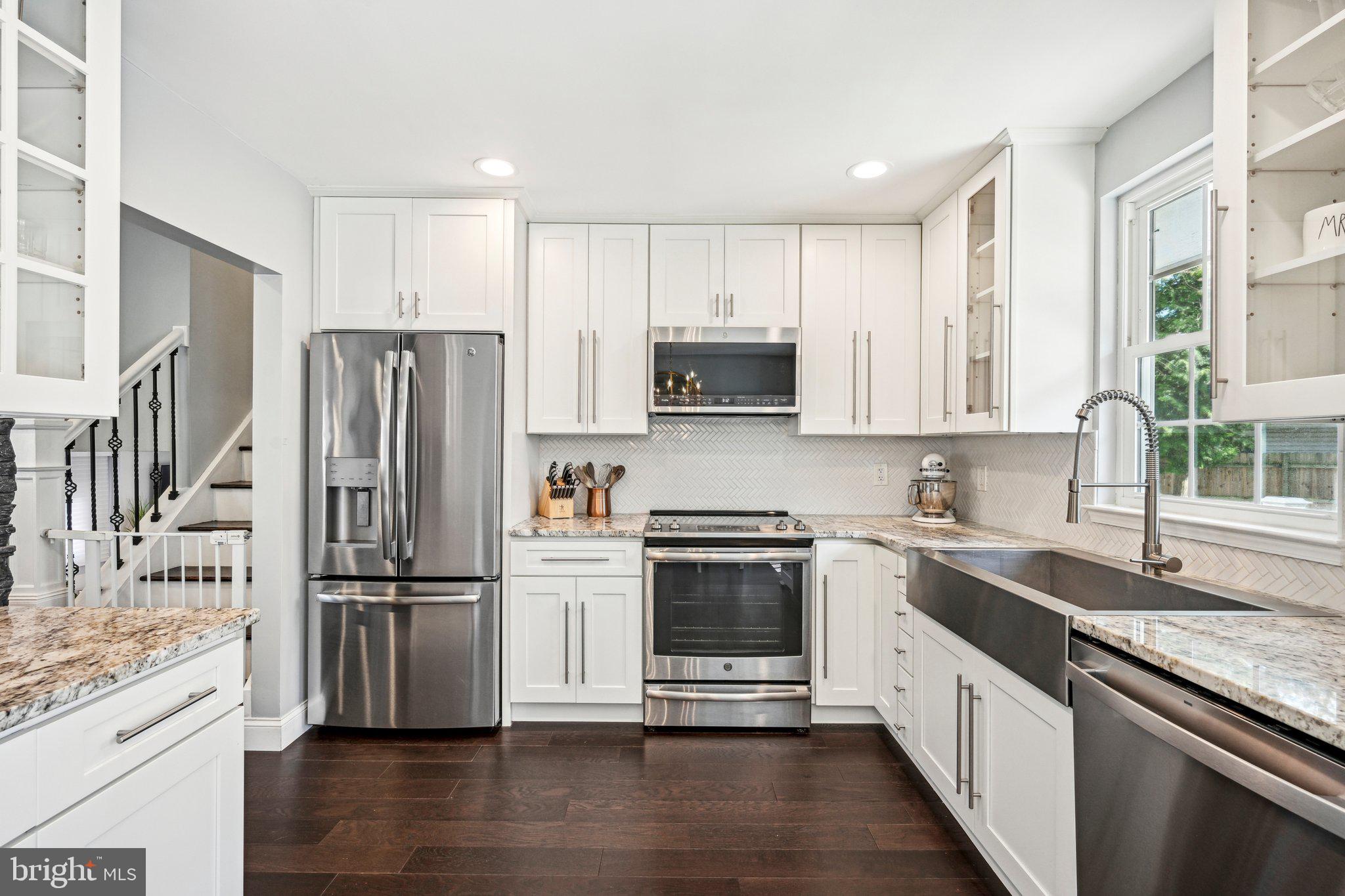 42 Cameo Road Claymont, DE 19703 - Photo 11 of 37 a kitchen with stainless steel appliances granite countertop a refrigerator sink and stove