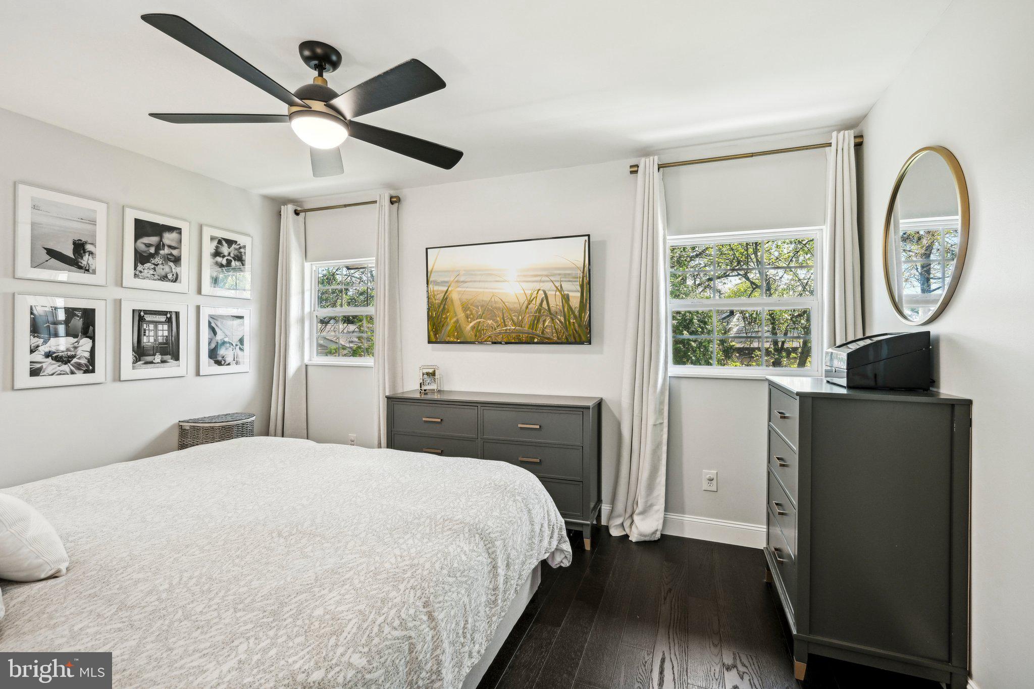 42 Cameo Road Claymont, DE 19703 - Photo 13 of 37 a bedroom with a large bed and a chandelier
