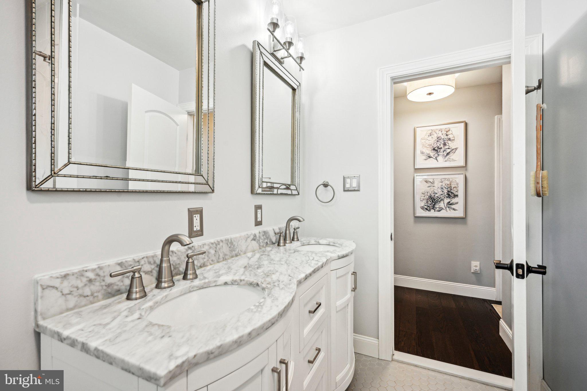 42 Cameo Road Claymont, DE 19703 - Photo 21 of 37 a bathroom with a sink and a mirror