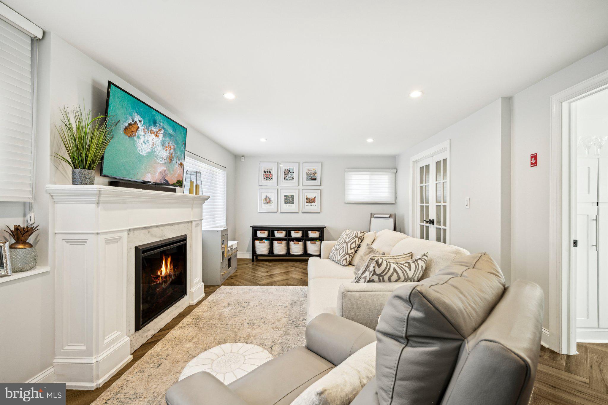 42 Cameo Road Claymont, DE 19703 - Photo 22 of 37 a living room with furniture a fireplace and a flat screen tv
