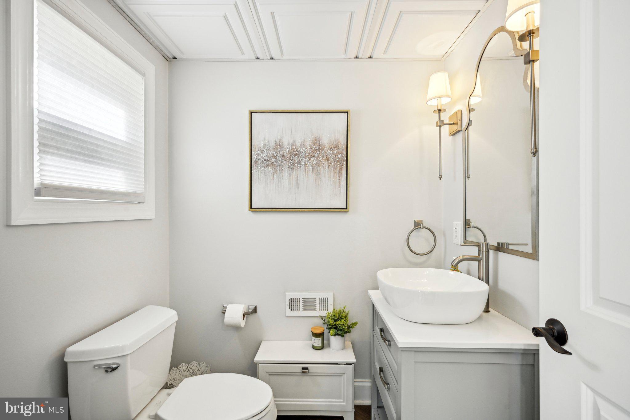 42 Cameo Road Claymont, DE 19703 - Photo 28 of 37 a bathroom with a toilet sink and mirror