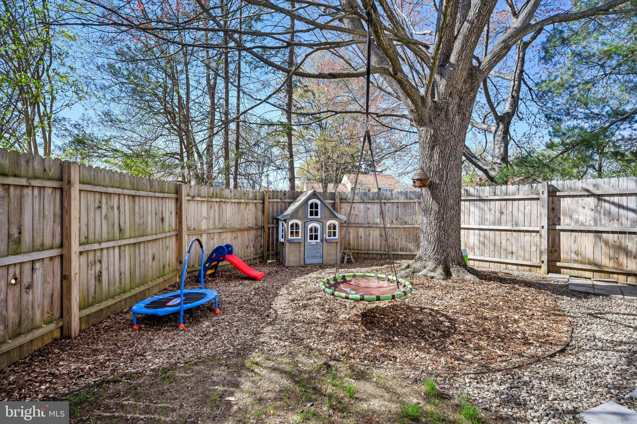 42 Cameo Road Claymont, DE 19703 - Photo 36 of 37 a backyard of a house with barbeque oven table and chairs