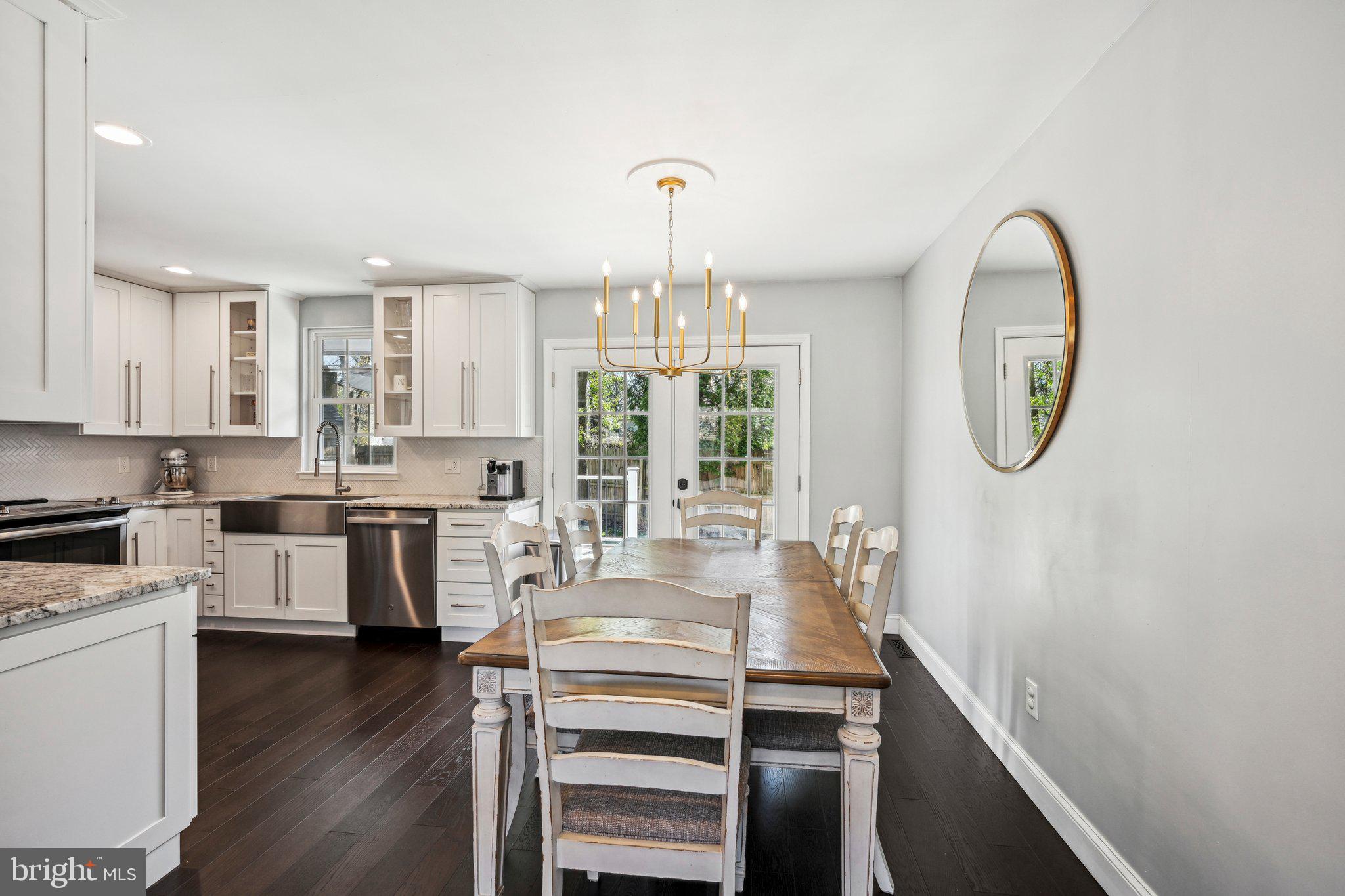 42 Cameo Road Claymont, DE 19703 - Photo 8 of 37 a kitchen with a dining table chairs and chandelier