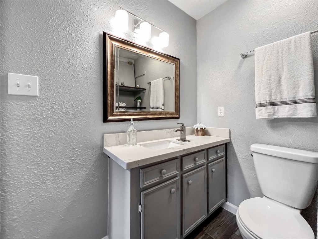 6347 Limestone Street Houston, TX 77092 - Photo 14 of 26 This elegant ensuite bath features a chic vanity with ample storage, complemented by a sleek modern design for a touch of luxury in your daily routine.