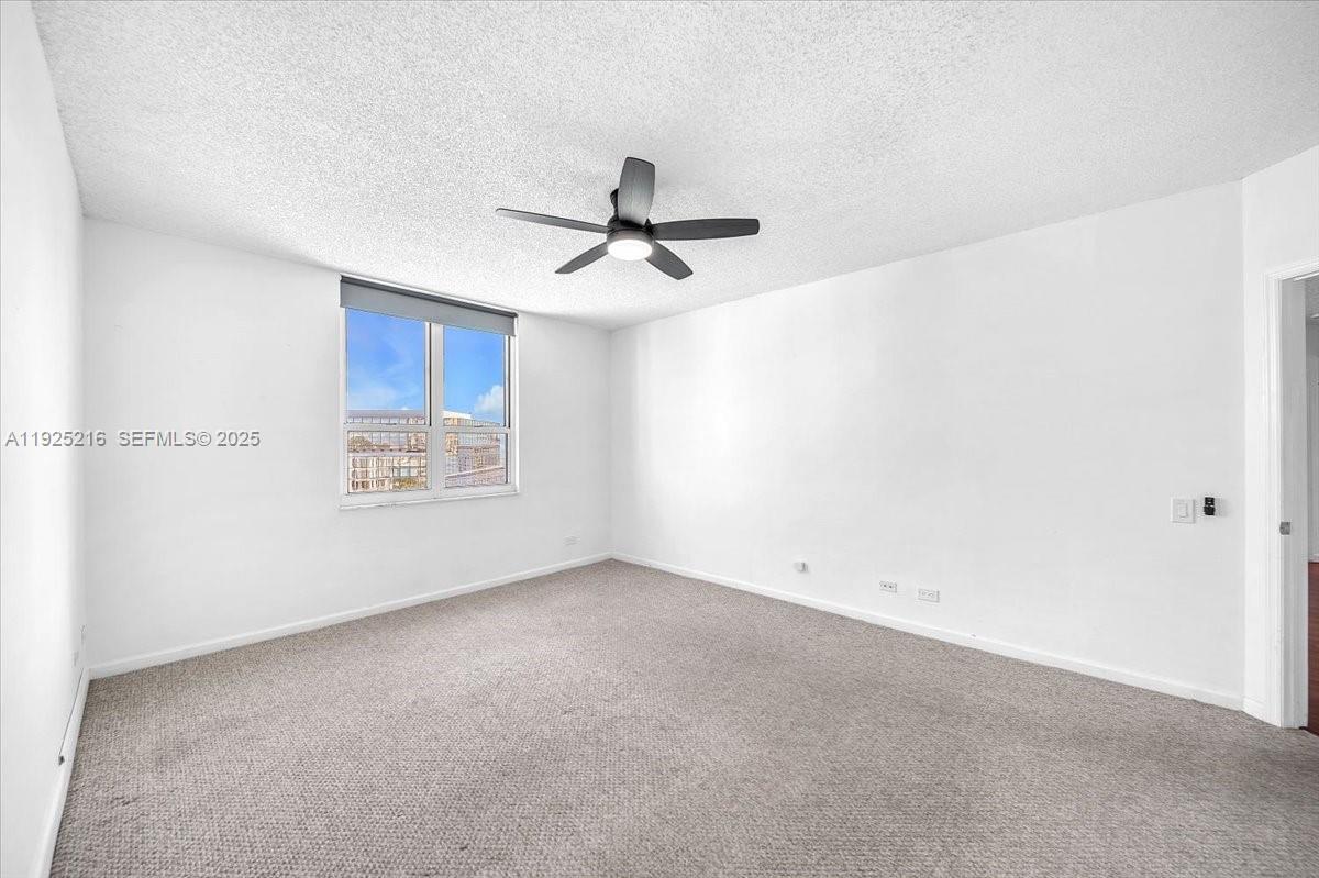 701 Brickell Key Boulevard, Unit 1911 Miami, FL 33131 - Photo 18 of 39 wooden floor in an empty room