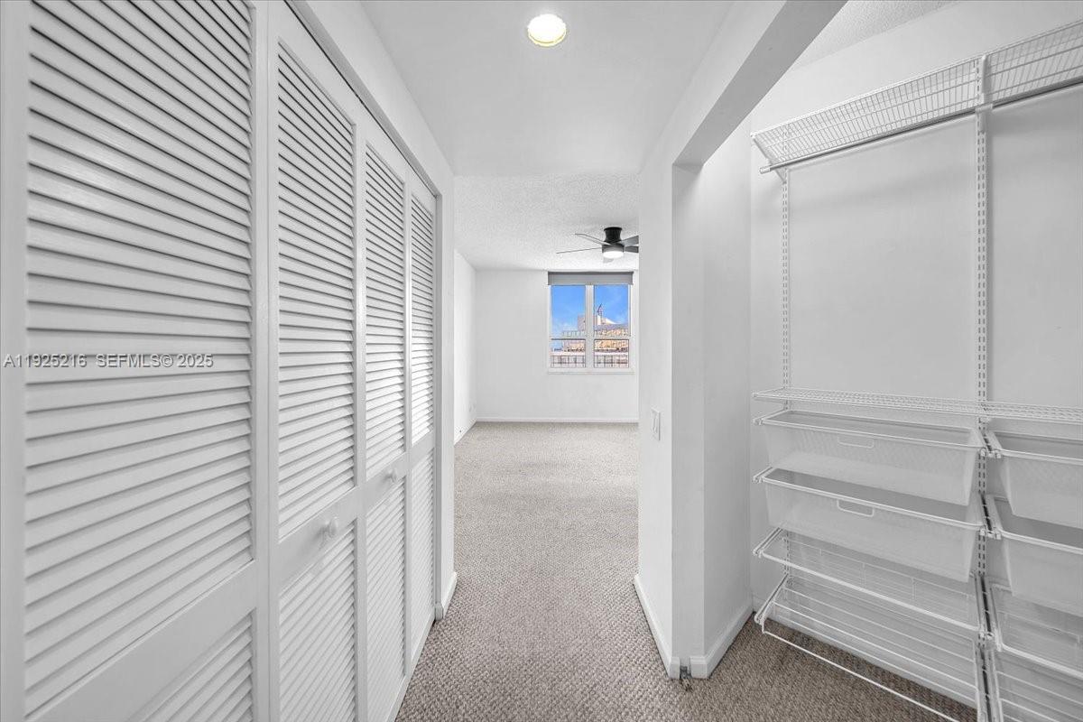701 Brickell Key Boulevard, Unit 1911 Miami, FL 33131 - Photo 21 of 39 a view of a hallway with closet
