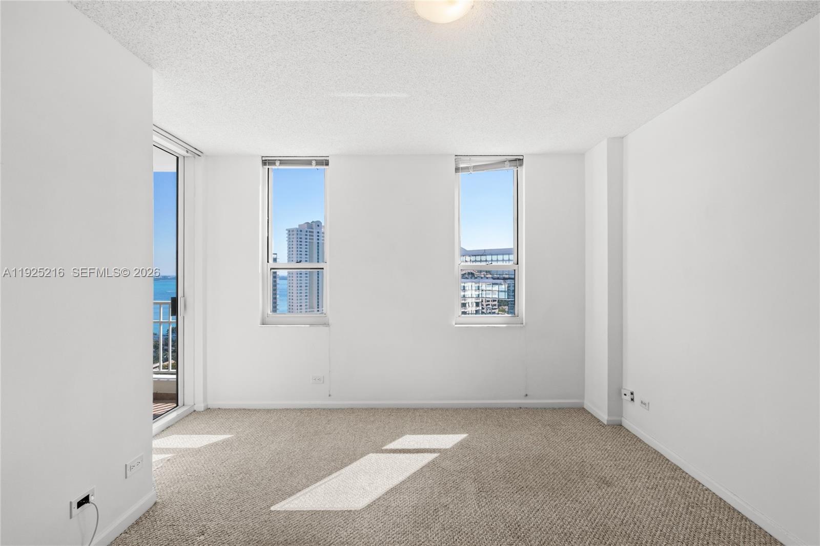 701 Brickell Key Boulevard, Unit 1911 Miami, FL 33131 - Photo 47 of 75 a view of an empty room with a window