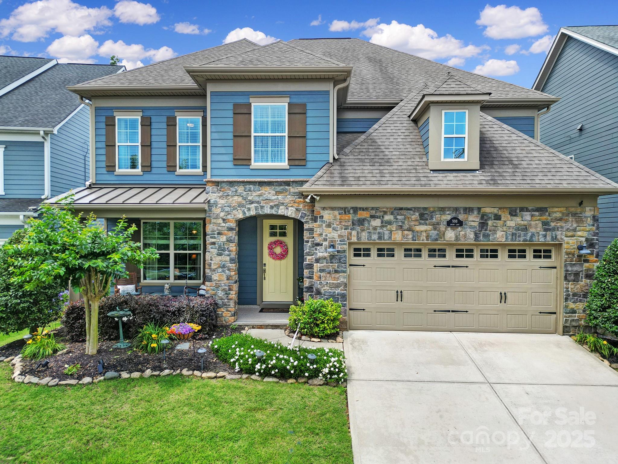 998 Emory Lane Fort Mill, SC 29708 - Photo 1 of 48 a front view of a house with a garden