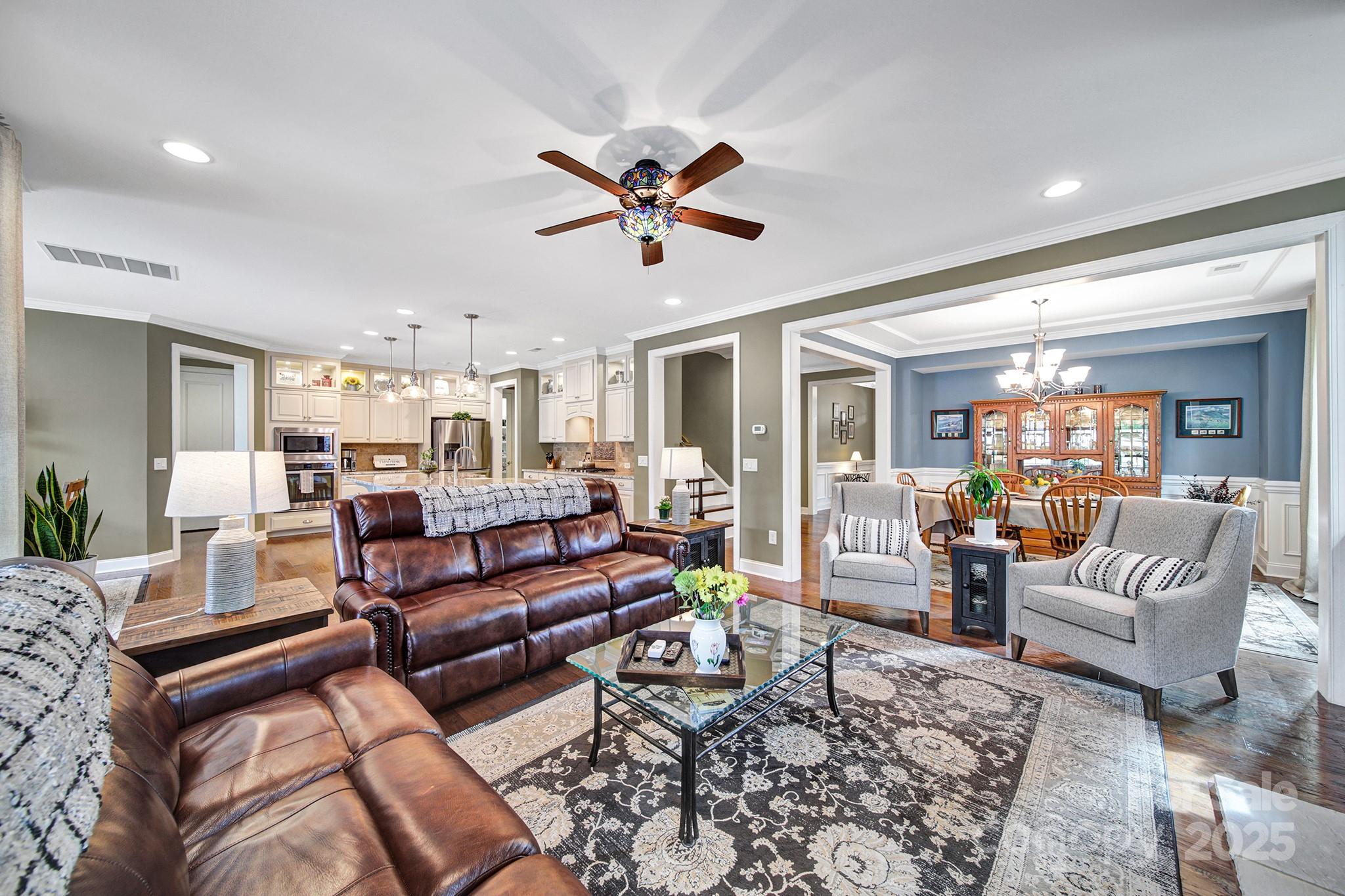 998 Emory Lane Fort Mill, SC 29708 - Photo 15 of 48 a living room with furniture ceiling fan and a rug