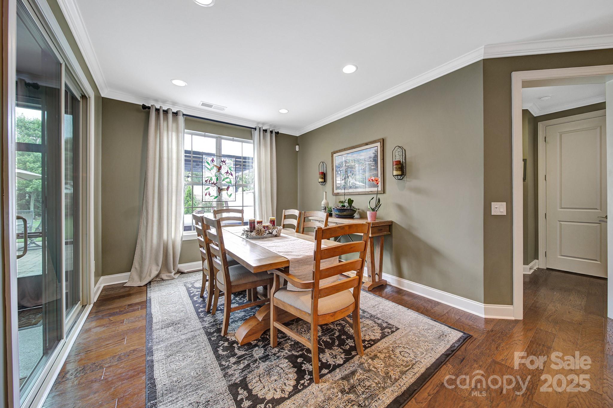 998 Emory Lane Fort Mill, SC 29708 - Photo 16 of 48 a view of a dining room with furniture window and wooden floor