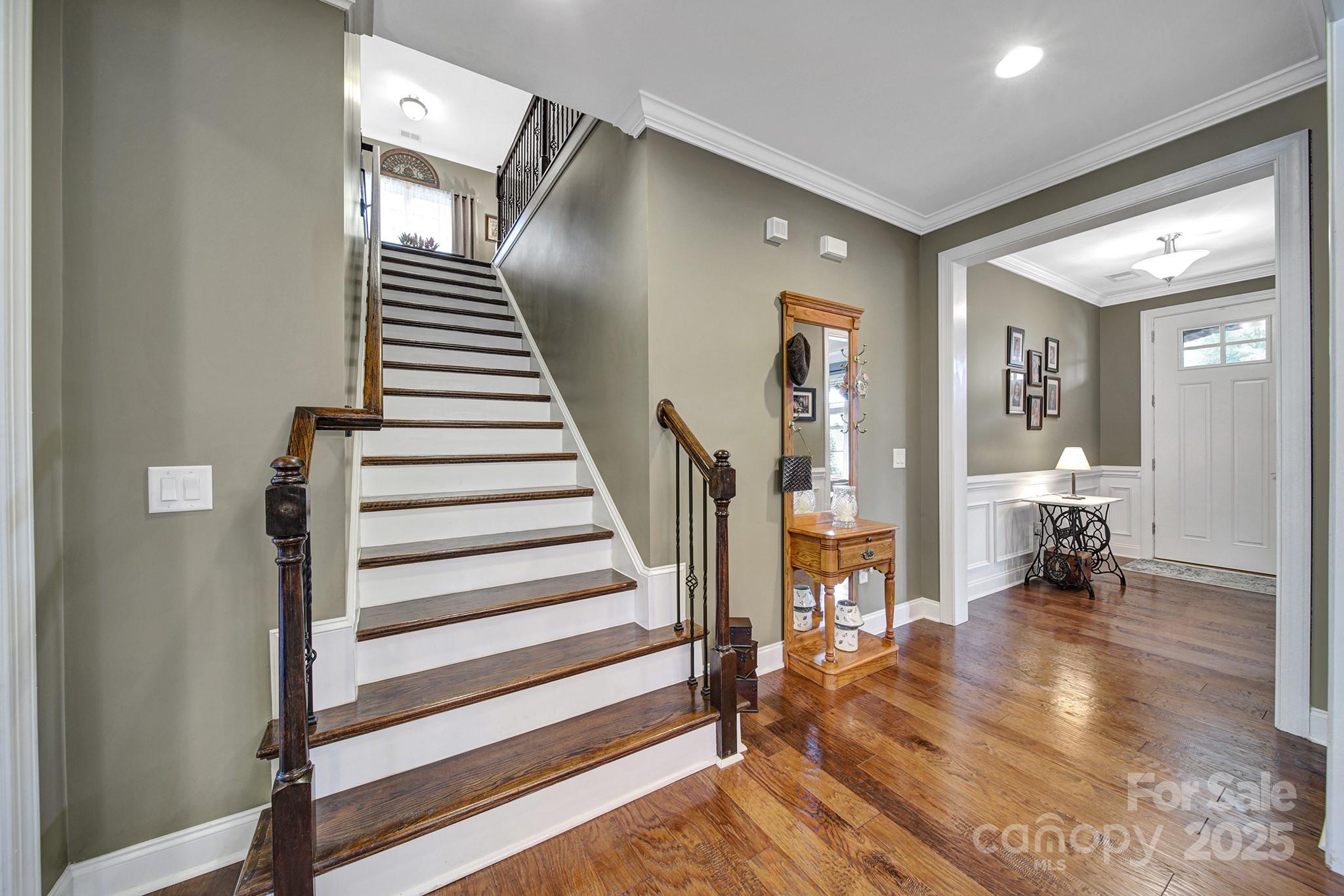 998 Emory Lane Fort Mill, SC 29708 - Photo 20 of 48 a view of a hallway with wooden floor and staircase