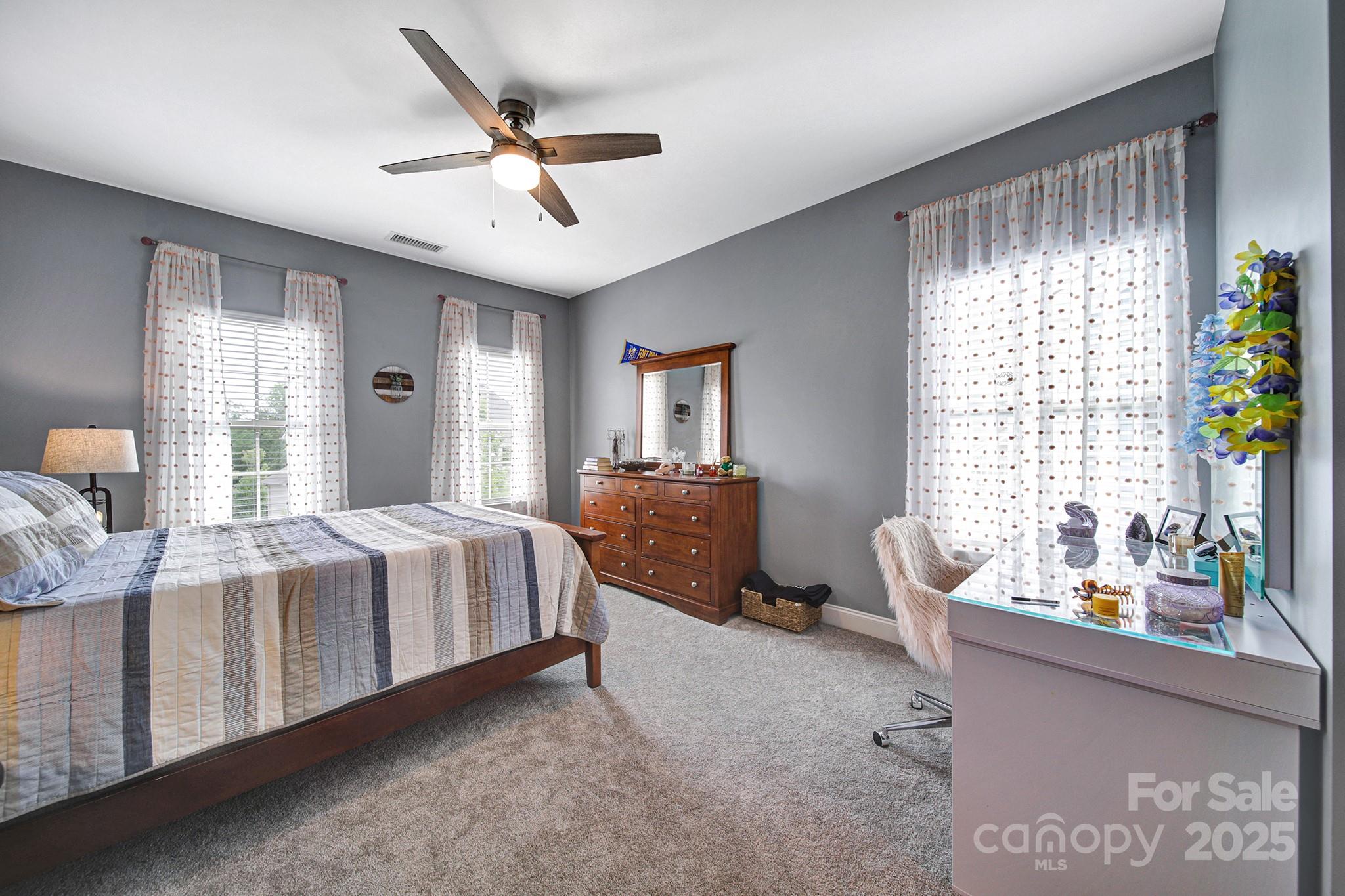 998 Emory Lane Fort Mill, SC 29708 - Photo 29 of 48 a bedroom with a bed and large windows