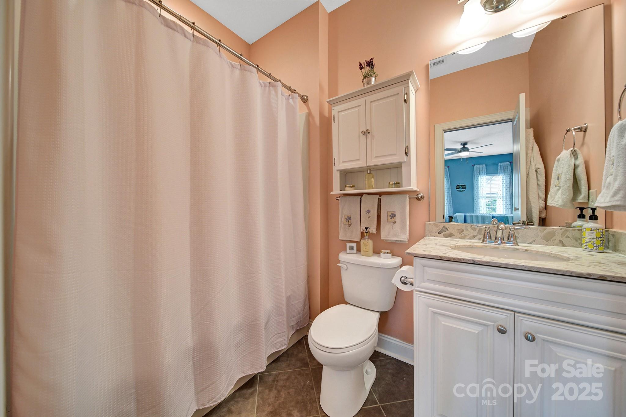 998 Emory Lane Fort Mill, SC 29708 - Photo 30 of 48 a bathroom with a granite countertop sink toilet and mirror