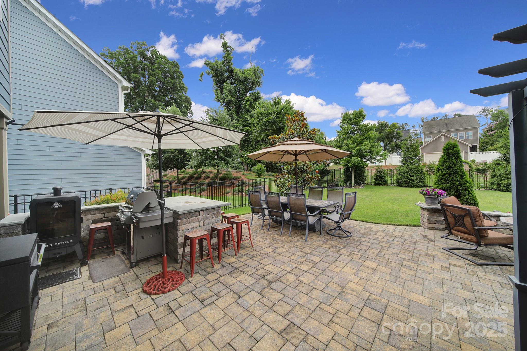 998 Emory Lane Fort Mill, SC 29708 - Photo 36 of 48 a view of a tables and chairs under an umbrella