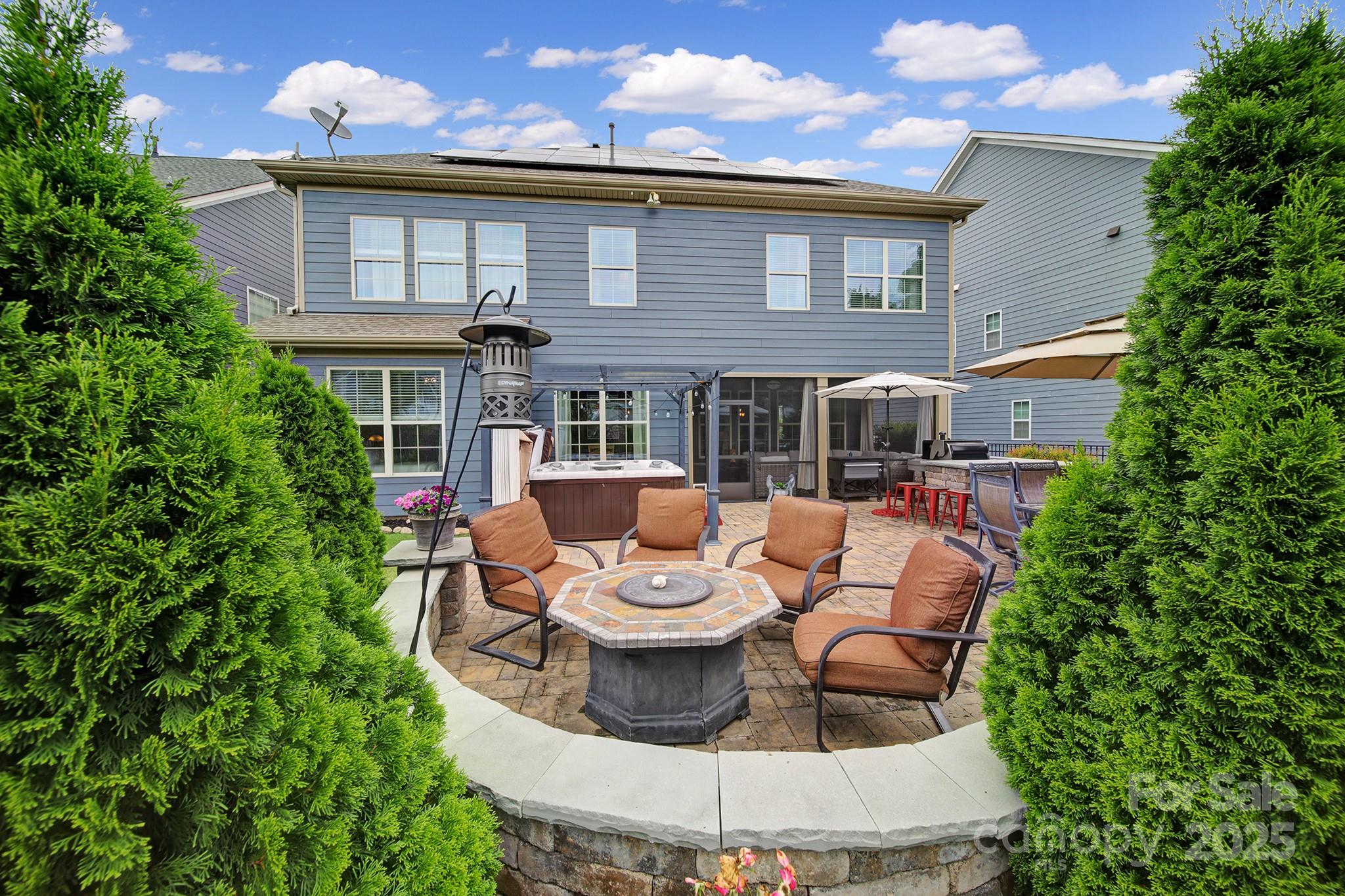 998 Emory Lane Fort Mill, SC 29708 - Photo 40 of 48 a view of a patio with couches table and chairs and potted plants