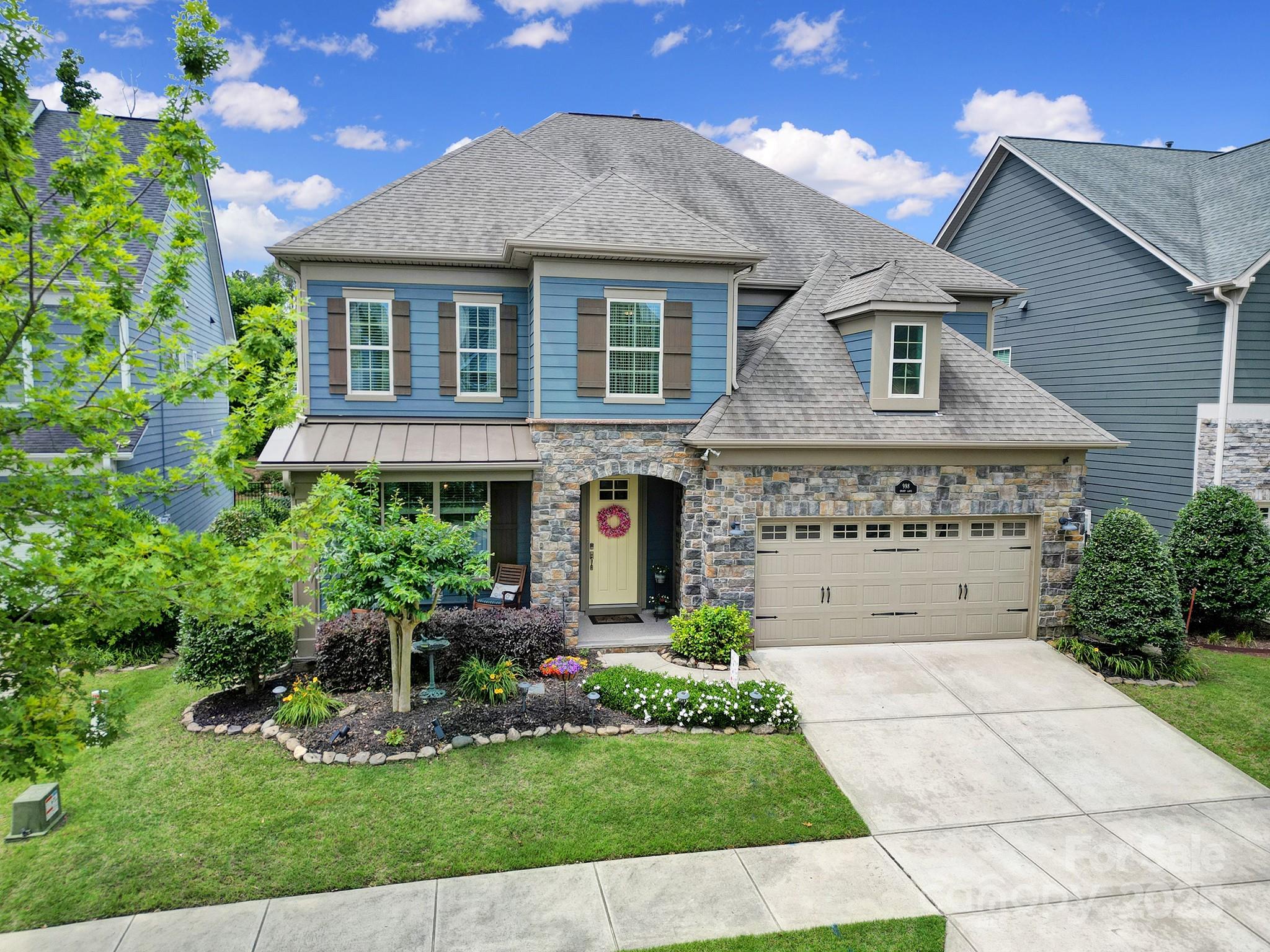 998 Emory Lane Fort Mill, SC 29708 - Photo 45 of 48 a front view of a house with a garden and plants