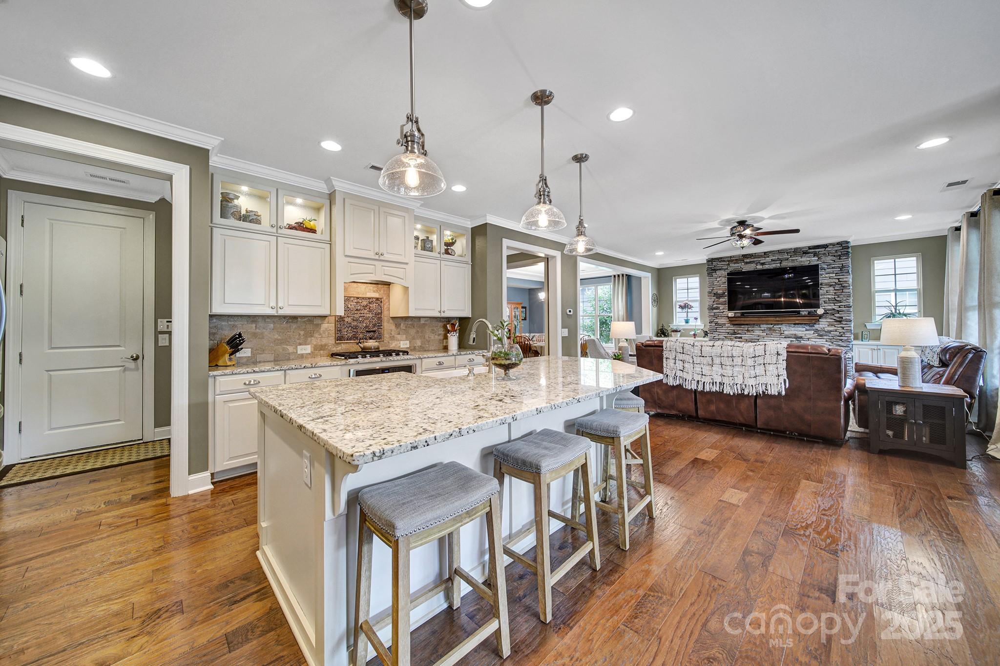998 Emory Lane Fort Mill, SC 29708 - Photo 6 of 48 a open kitchen with stainless steel appliances granite countertop a stove and refrigerator