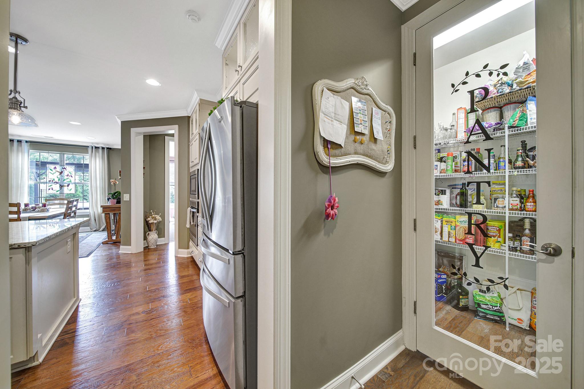 998 Emory Lane Fort Mill, SC 29708 - Photo 10 of 48 wooden floor in a kitchen and an empty room