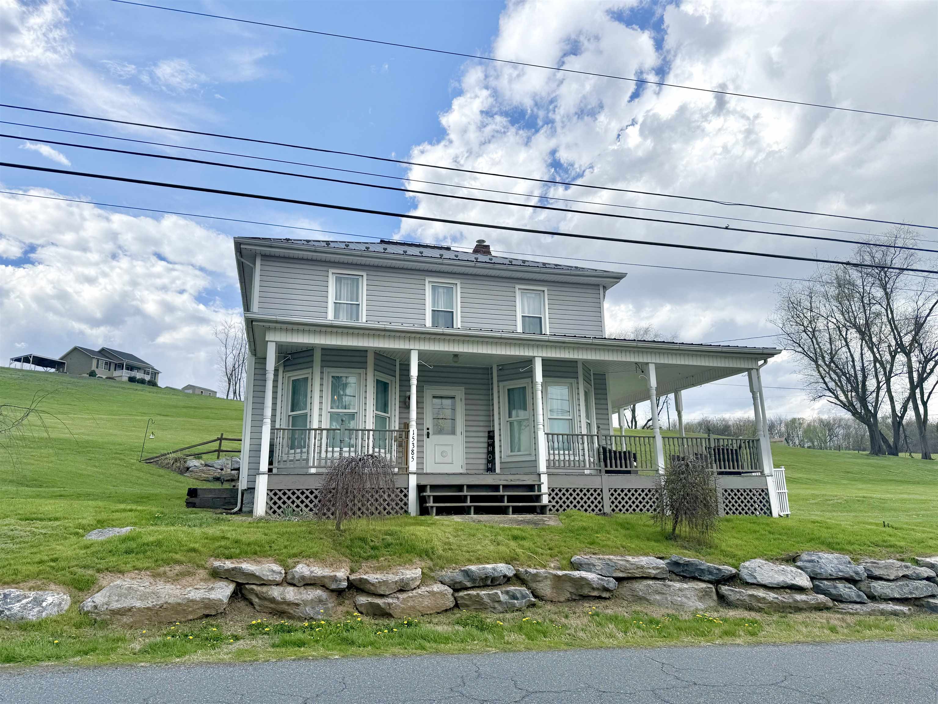 15385 Evergreen Valley Road Timberville, VA 22853 - Photo 1 of 44 a front view of a house with garden