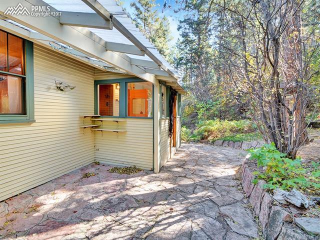 9395 Ute Road Cascade, CO 80809 - Photo 28 of 35 Private flagstone patio on the backside of home