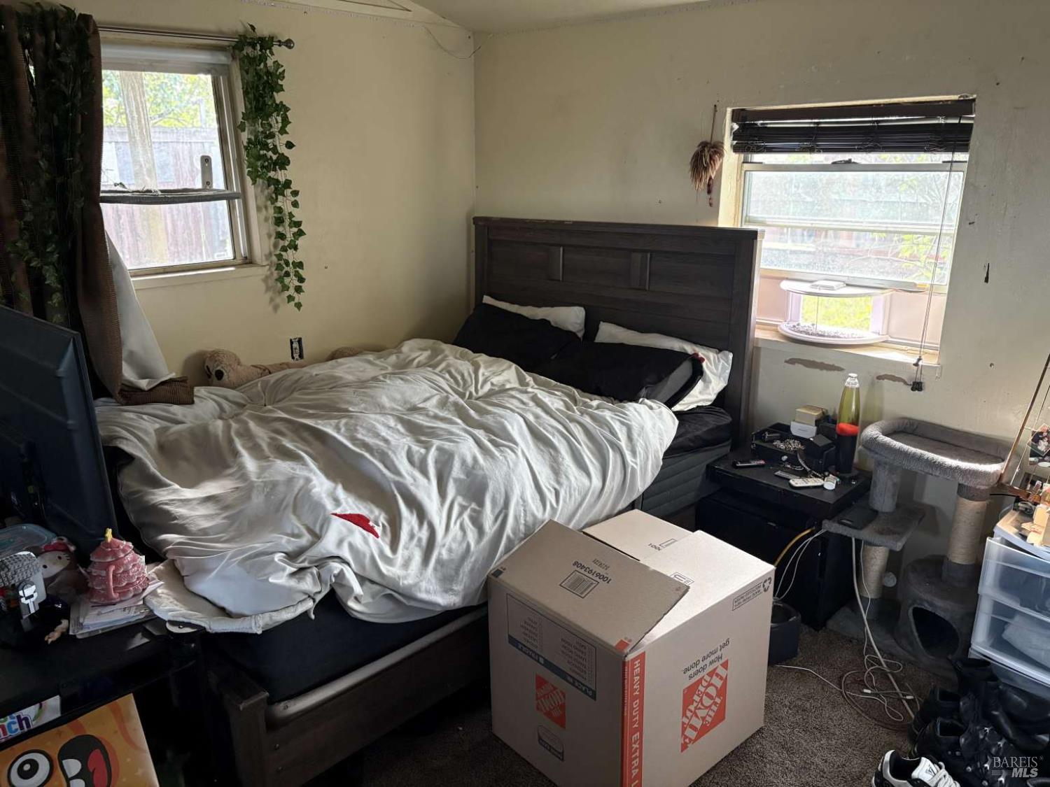 2808 Fulton Road Fulton, CA 95439 - Photo 12 of 15 a bed sitting in a bedroom next to a window