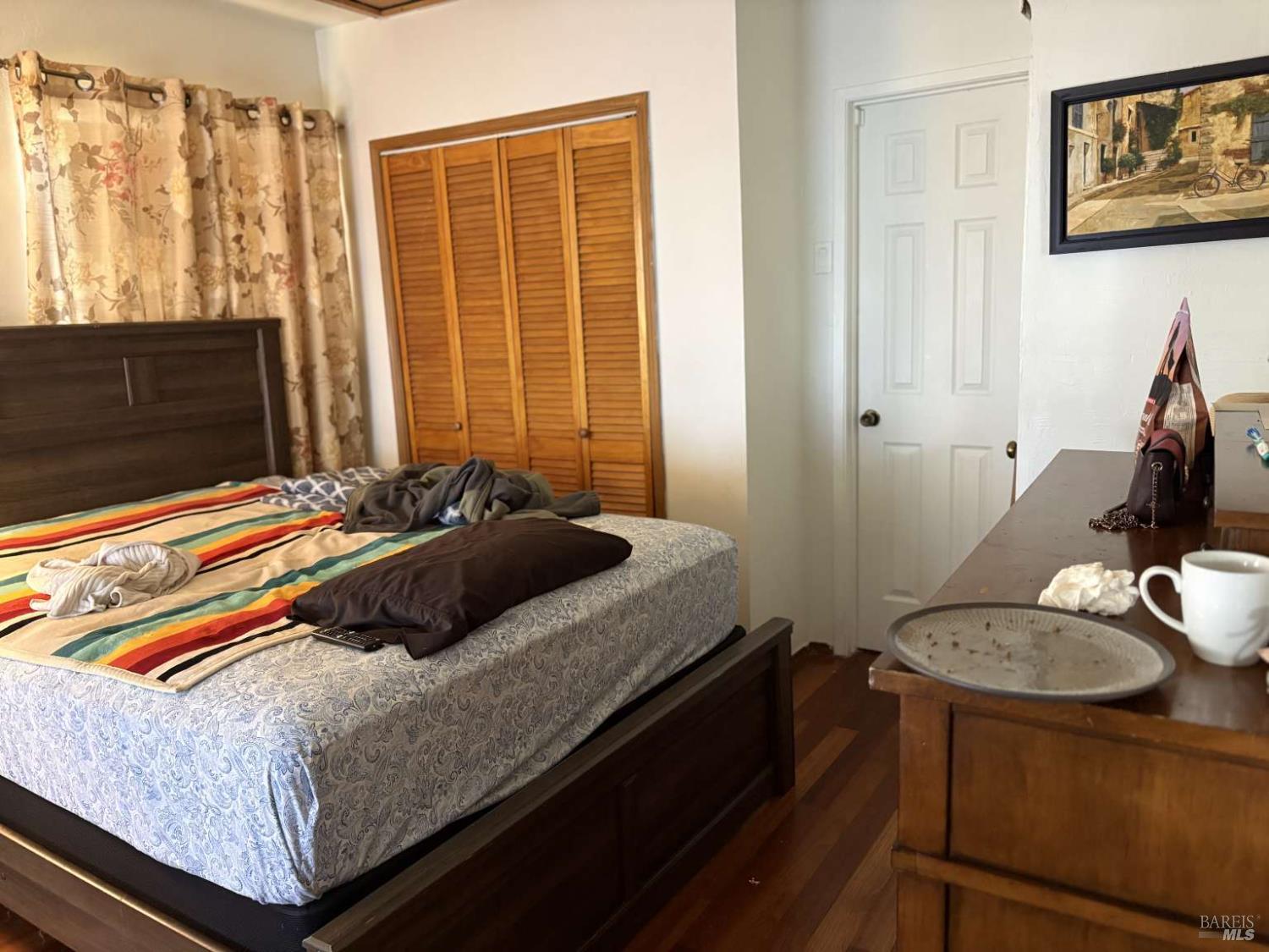 2808 Fulton Road Fulton, CA 95439 - Photo 14 of 15 a bedroom with a bed and wooden floor