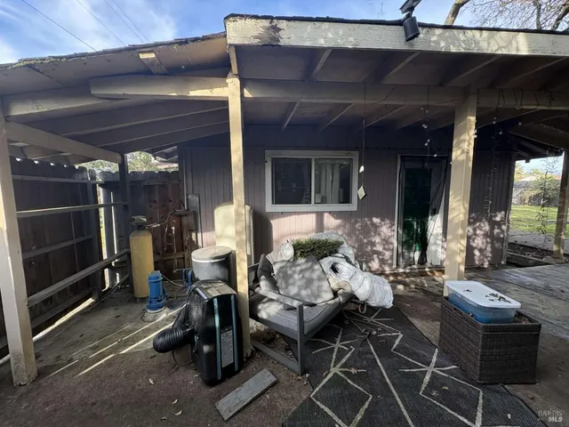 an outdoor living area with furniture