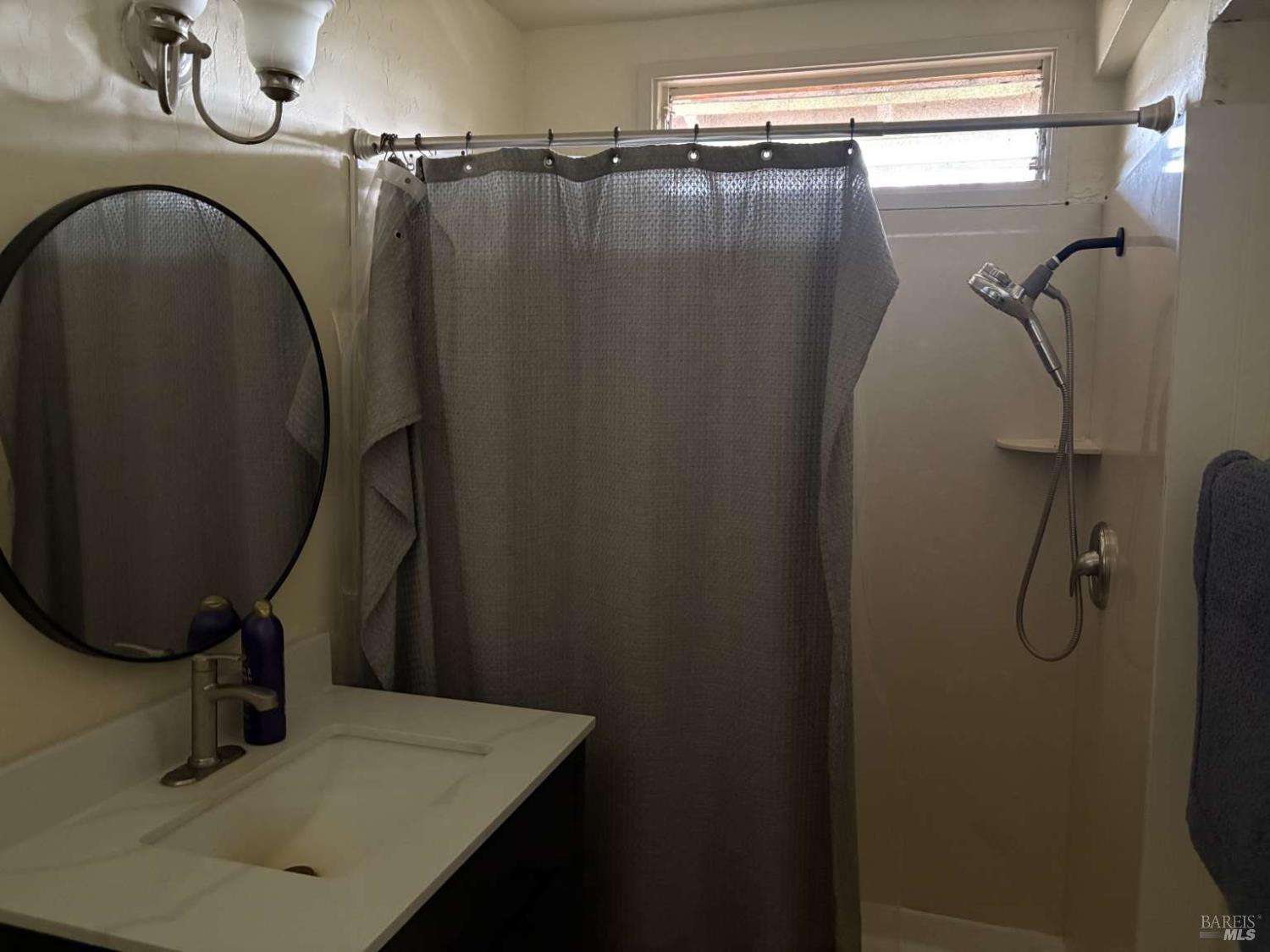 2808 Fulton Road Fulton, CA 95439 - Photo 9 of 15 a bathroom with a sink and mirror