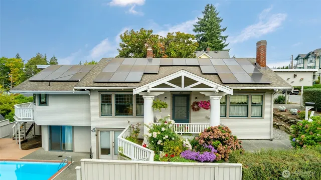 a view of small house with potted plants