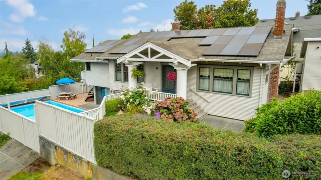 a front view of a house with garden