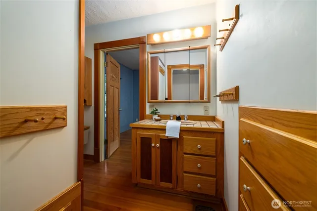a view of cabinets and wooden floor