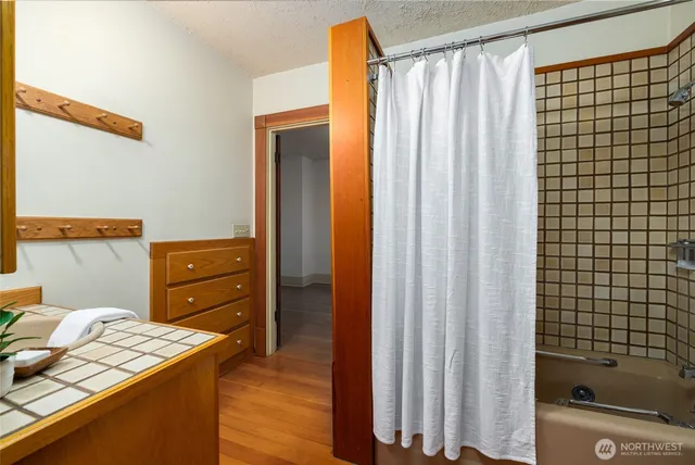 a kitchen with a refrigerator and a sink